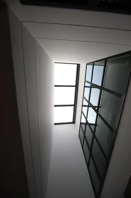 a room with a window and a mirror at Chic Ekkamai Escape Near BTS, Dining & Nightlife in Bangkok