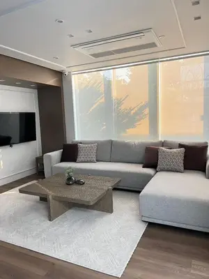 a living room with a couch and a table at Around Ari Hostel in Bangkok