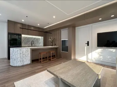 a kitchen with a sink and a counter top at Around Ari Hostel in Bangkok