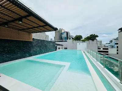 a swimming pool on the roof of a building at 6th Avenue Sukhumvit BKK 407 BTS Asoke Nana in Bangkok