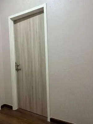 a wooden door in the middle of a room at The Gabriel House in Ban Bang Khen (1)