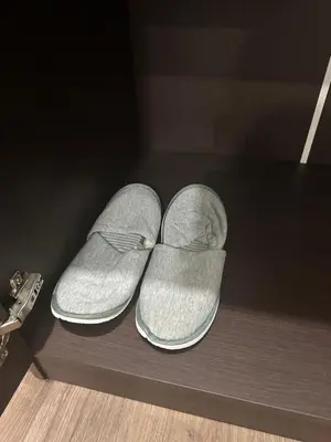 a pair of shoes sitting on a table at The Gabriel House in Ban Bang Khen (1)