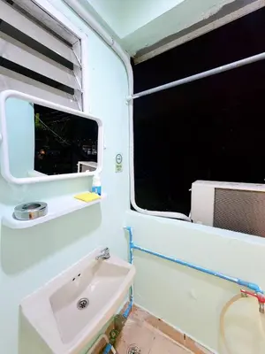 a bathroom with a sink and a window at 202-STP Homely room Free Wi-Fi and Near BTS in Sathani Bang Khen
