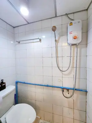 a bathroom with a toilet and a shower at 202-STP Homely room Free Wi-Fi and Near BTS in Sathani Bang Khen