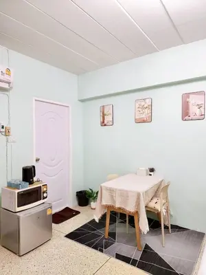 a dining room with a table and a microwave at 202-STP Homely room Free Wi-Fi and Near BTS in Sathani Bang Khen