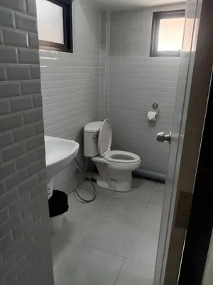 a white bathroom with a toilet and a sink at xx Yellow Place Sukhumvit Soi 2 -เยลโล เพลส สุขุมวิทซอย 2 in Bangkok