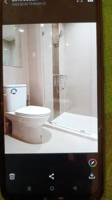 a picture of a bathroom with a toilet and a shower at IDEO Wat Thaphra Bangkok Yai in Bangkok