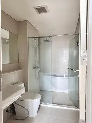 a bathroom with a shower and a toilet and a sink at Modern Place Watthana, Thonglor BTS, Sukhumvit in Bangkok