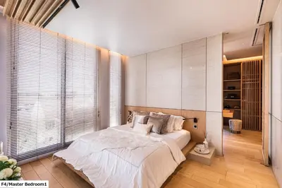 a bedroom with a large bed and a large window at Luxury Home Office Srinakarin in Lat Krabang