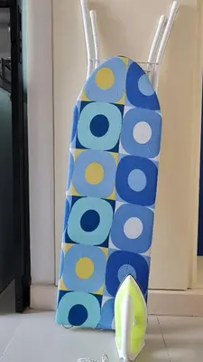 a blue and yellow chair sitting in a room at 1Br HiSpeed Net, Low rise condo, Near BTS Ekamai in Khlong Toei