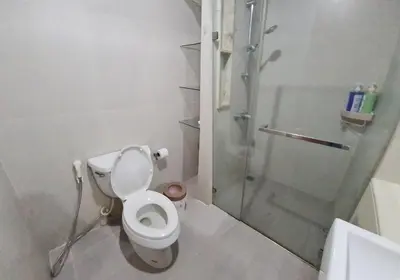 a bathroom with a shower and a toilet and a sink at 1Br HiSpeed Net, Low rise condo, Near BTS Ekamai in Khlong Toei