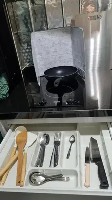 a frying pan sitting on top of a stove at 1Br HiSpeed Net, Low rise condo, Near BTS Ekamai in Khlong Toei