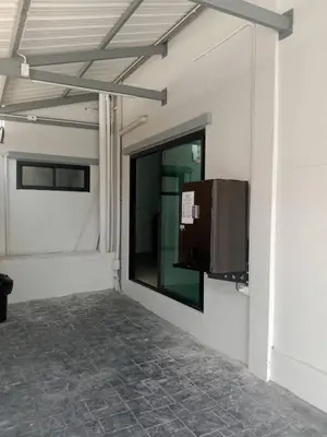 a building with a window and a tv on the wall at xx Yellow Place Sukhumvit 2 - BTS Nana Pro in Bangkok