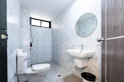 a bathroom with a white toilet and a sink at xx Yellow Place Sukhumvit 2 - BTS Nana Pro in Bangkok