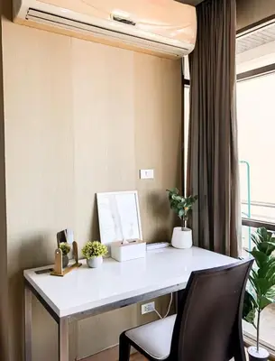 an office with a desk with a chair and plants at Spacious and Renovated 1-Bedroom 100m to Nana BTS - 55 sqm in Bangkok