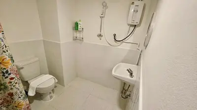 a small bathroom with a toilet and a sink at Bangrak house 200 meters near BTS SaphanTaksin in city in Chinatown
