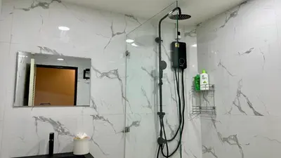 a bathroom with a shower and a mirror at Bangrak house 200 meters near BTS SaphanTaksin in city in Chinatown