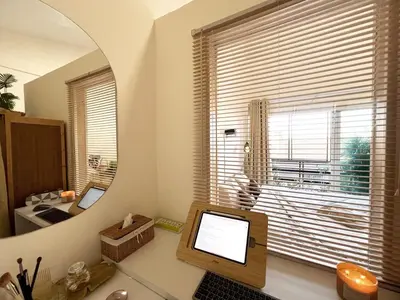 a room with a desk with a computer and a mirror at Enjoyo getaway in Ban Zong Katiam