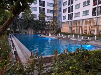a large swimming pool in the middle of a building at MRT SaiMa D condo monthly rent in Ban Sai Ma