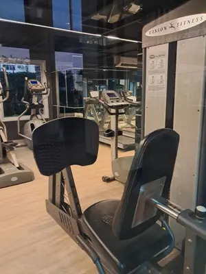 a gym with several treadmills and elliptical machines at MRT SaiMa D condo monthly rent in Ban Sai Ma