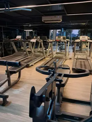 a gym with rows of treadmills and machines at MRT SaiMa D condo monthly rent in Ban Sai Ma
