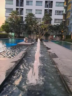 two white swans in a pool at a hotel at MRT SaiMa D condo monthly rent in Ban Sai Ma