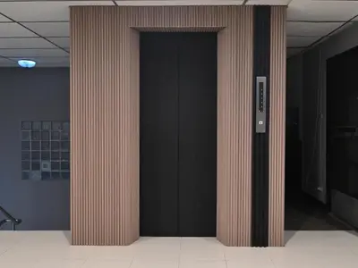 a pair of columns in a room with black walls at Floton Bangkok Hotel in Bangkok