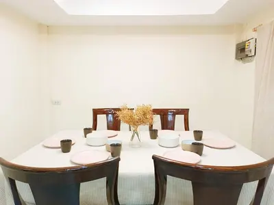 a dining room with a table and two chairs at Retreat House 81 - BTS Onnut in Bangkok