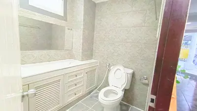 a bathroom with a toilet and a sink at Retreat House 81 - BTS Onnut in Bangkok