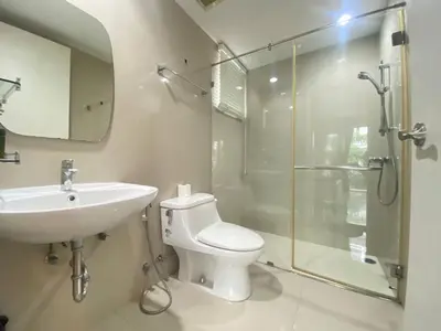 a bathroom with a toilet and a shower and a sink at 3 Bedroom Spacious Home in Downtown Bangkok Near MRT BTS Asok Station in Bangkok