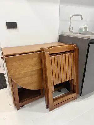 a kitchen with a sink and a wooden desk at Impact - Donmueng Popular C4 in Ban Song Hong