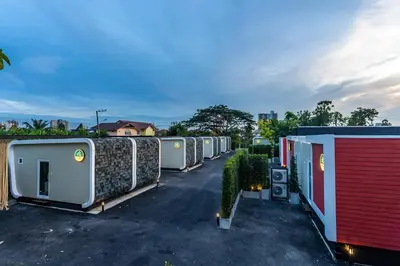 a row of mobile homes in a parking lot at NY Resort Nonthaburi in Nonthaburi