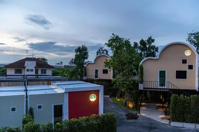 a view of a row of buildings at dusk at NY Resort Nonthaburi in Nonthaburi