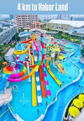 an image of a water park with the text km to harbor land at Inspire place rama9 Modern Condo near Rajamangala Stadium Pool and Gym in Bangkok