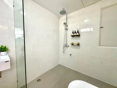 a bathroom with a shower and a toilet in it at Luxury 3 bedrooms in the heart of the city in Bangkok