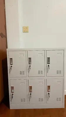 a bunch of lockers are lined up against a wall at Delight Hostel at Khao San in Bangkok