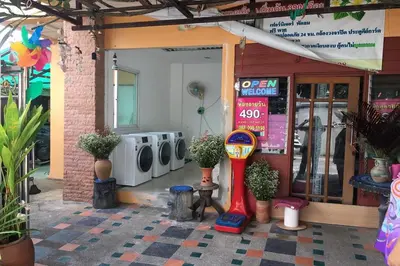 a store front with a parking meter in front of it at Green Place 107 in Bangkok