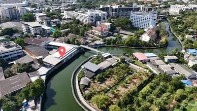 an aerial view of a city with a river at Canal Villa on Onnut Road, near Bts Onnut, Bangkok in Amphoe Phra Khanong
