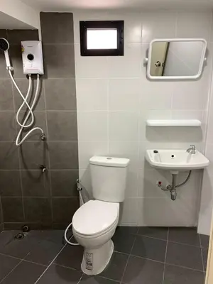 a bathroom with a toilet and a sink at Ari45 in Bangkok