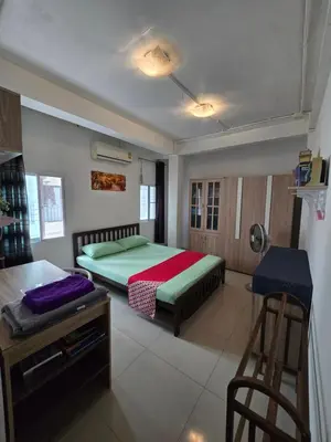 a bedroom with a bed and a ladder in it at Jatujak Bangkok guesthouse R3 in Sathani Bang Su