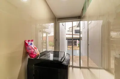 a glass table in a room with a window at Modern Townhouse City Center 4 Floors 13 Guests in Bangkok