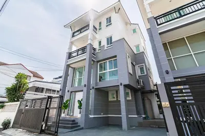 a house with a gate in front of it at Modern Townhouse City Center 4 Floors 13 Guests in Bangkok