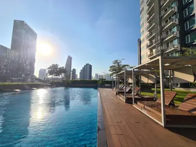 a view of a river in a city with buildings at Comfort Zone in Bangkok