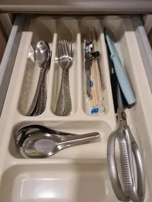 a drawer filled with utensils in a sink at Comfort Zone in Bangkok