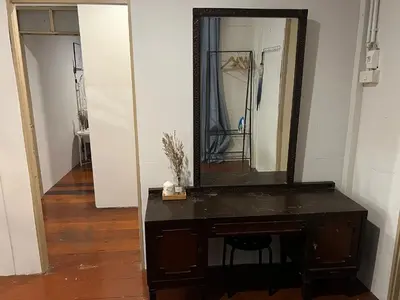 a mirror sitting on top of a table in a room at 3 bedrooms 2 bathroom's in Bang Su
