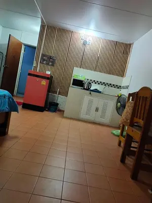 a kitchen with a stove and a red refrigerator at impact เมืองทองธานี ห้องเช่ารายวัน pupular condo T9 C5 C4 C9 T8 in Thung Si Kan