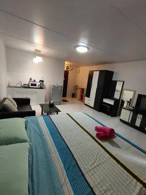 a living room with a large rug on the floor at impact เมืองทองธานี ห้องเช่ารายวัน pupular condo T9 C5 C4 C9 T8 in Thung Si Kan