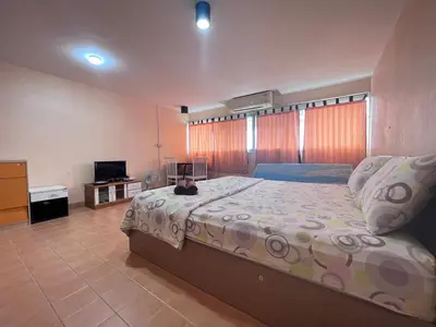 a bedroom with a large bed and a television at impact เมืองทองธานี ห้องเช่ารายวัน pupular condo T9 C5 C4 C9 T8 in Thung Si Kan