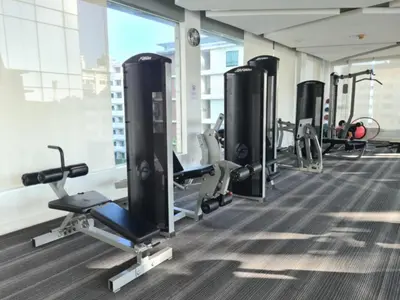 a gym with treadmills and cardio machines at Comfortable Zone in Khlong Toei