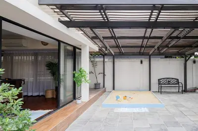 an indoor patio with a yoga mat on the floor at Luxurious 6BR Villa with Pool & Games at Sukhumvit in Bangkok